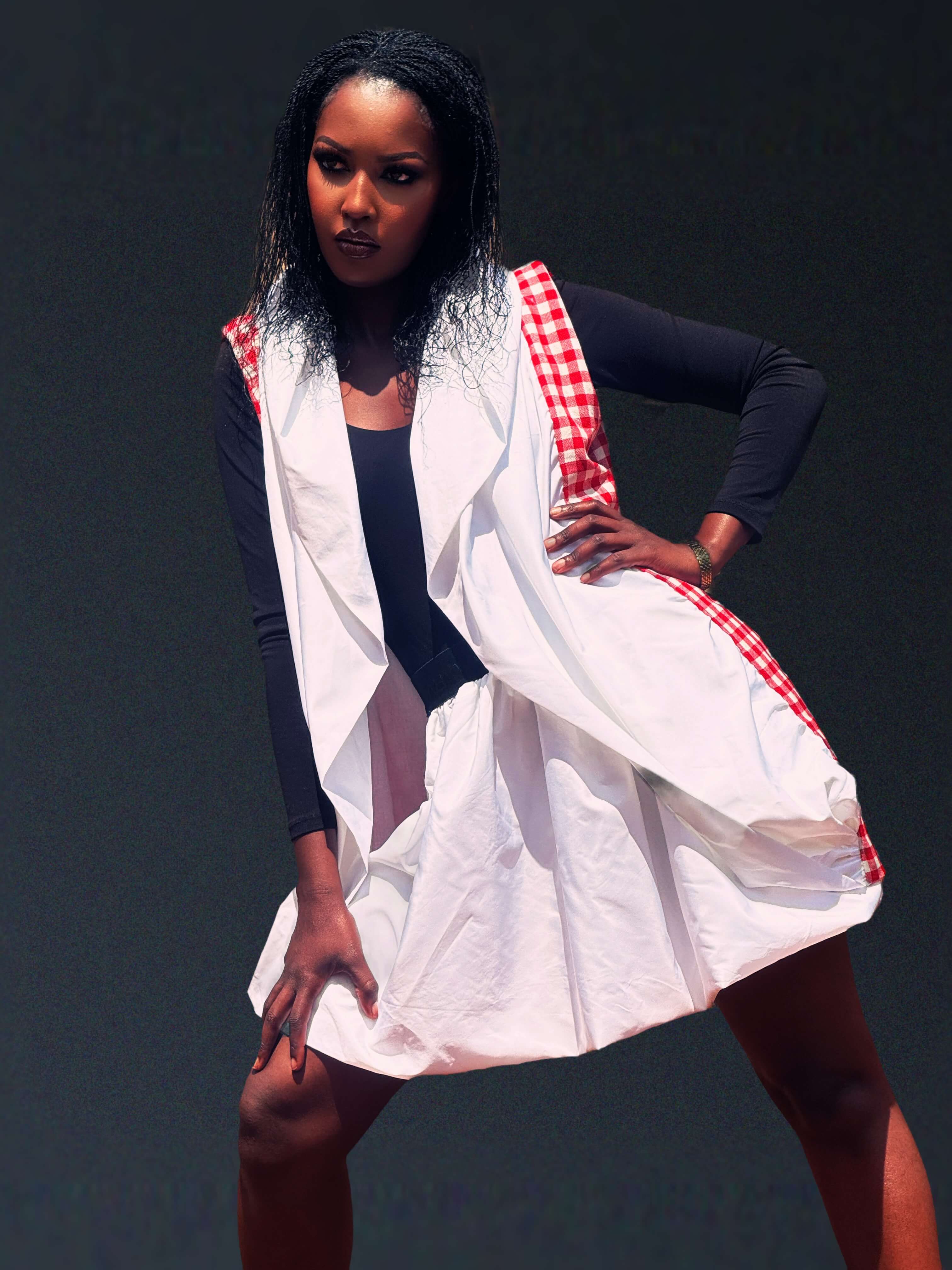 The Noor Convertible Coat, hood raised, side profile